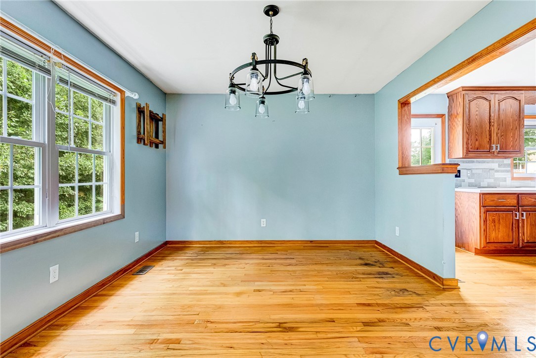 14050 West Patrick Henry Road Doswell, VA 23047 - Photo 9 of 38 Nice sized dining room with hardwood floors and up