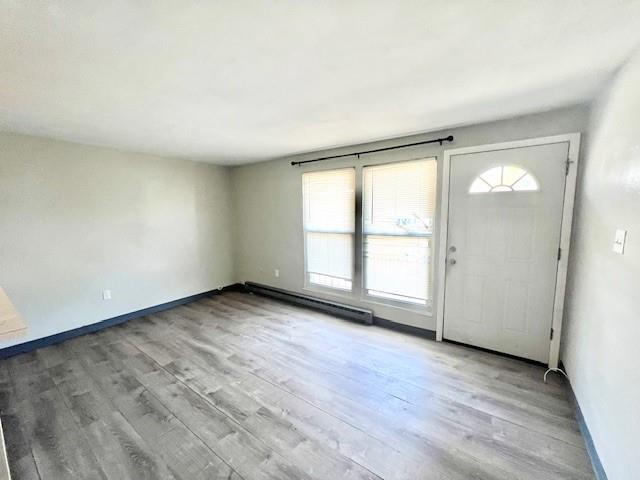 618 Union Street California, PA 15419 - Photo 4 of 10 an empty room with wooden floor and windows