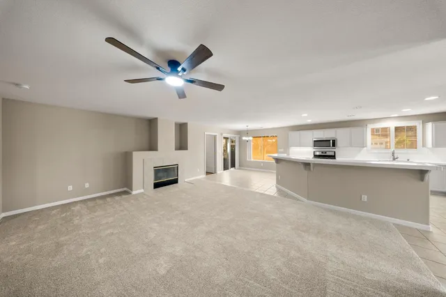 a view of empty room with a fireplace