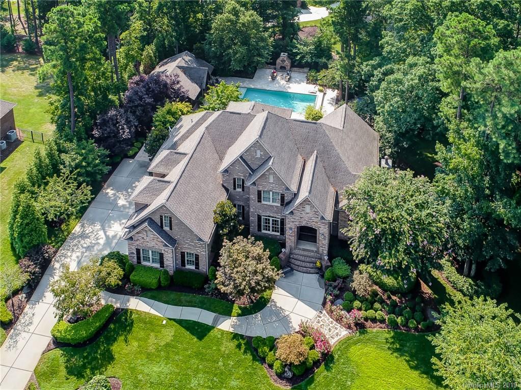 556 Medora Lane Fort Mill, SC 29708 - Photo 1 of 47 an aerial view of a house with a yard and swimming pool