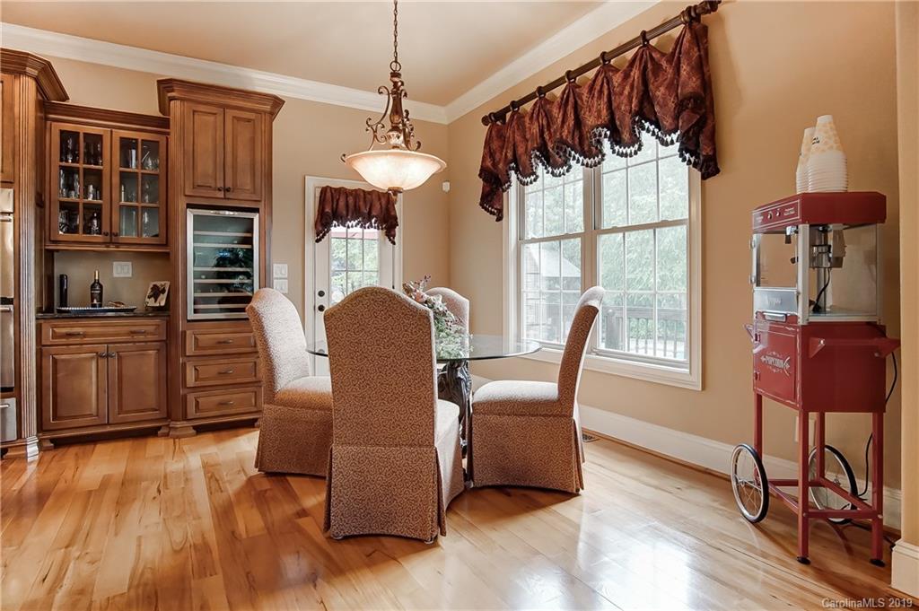 556 Medora Lane Fort Mill, SC 29708 - Photo 14 of 47 a view of a dining room with furniture window and wooden floor