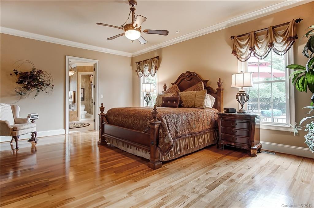 556 Medora Lane Fort Mill, SC 29708 - Photo 15 of 47 a bedroom with a bed and wooden floor