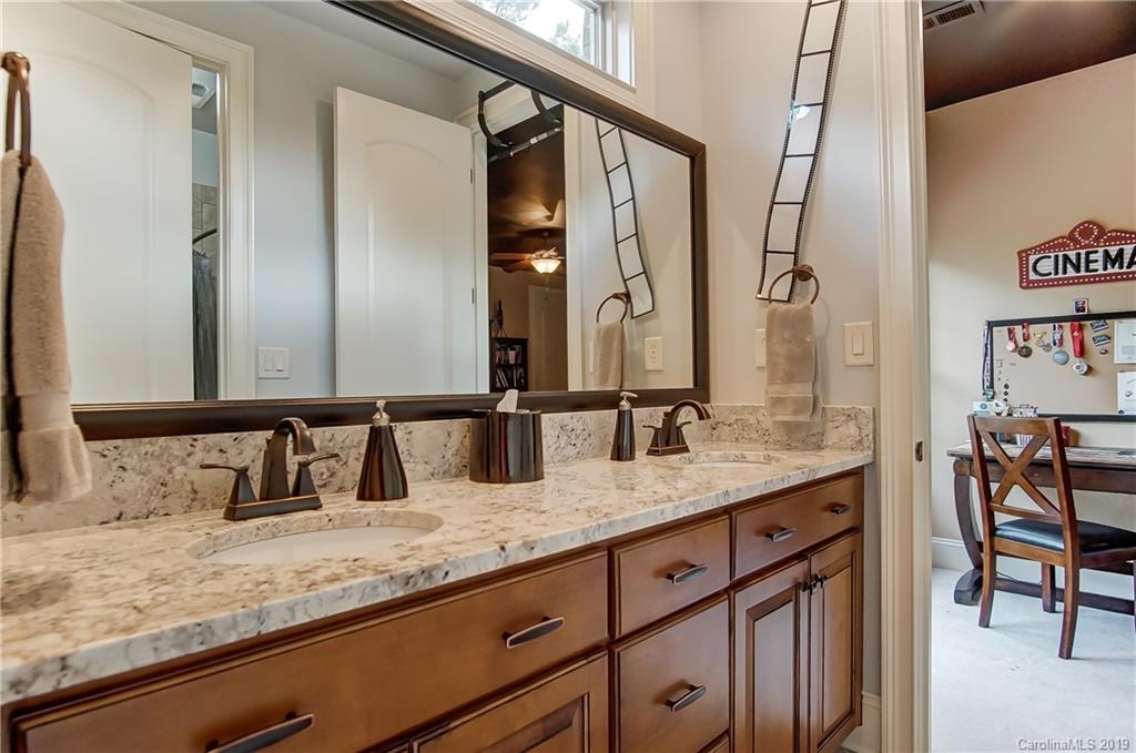 556 Medora Lane Fort Mill, SC 29708 - Photo 22 of 47 a bathroom with a granite countertop sink and a mirror