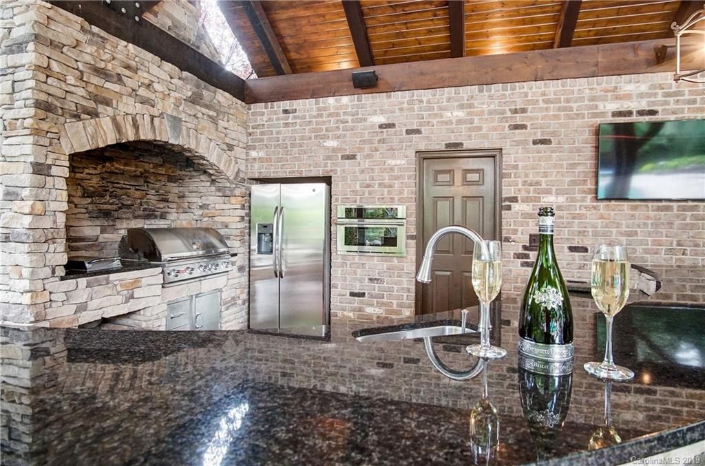 556 Medora Lane Fort Mill, SC 29708 - Photo 32 of 47 a kitchen with fireplace and stainless steel appliances