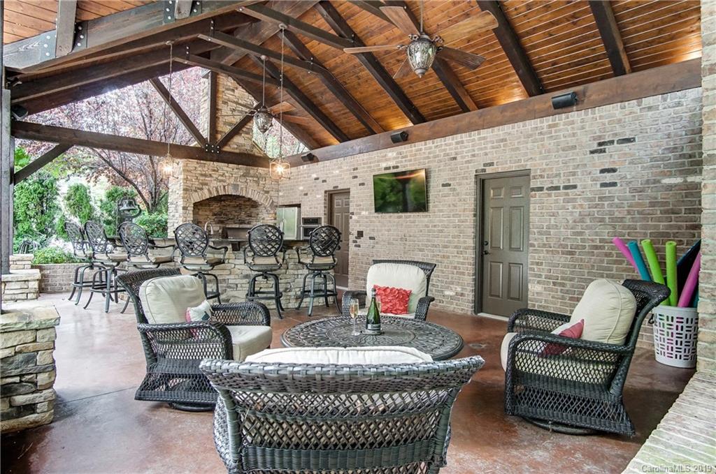 556 Medora Lane Fort Mill, SC 29708 - Photo 36 of 47 a outdoor living space with furniture and a fireplace