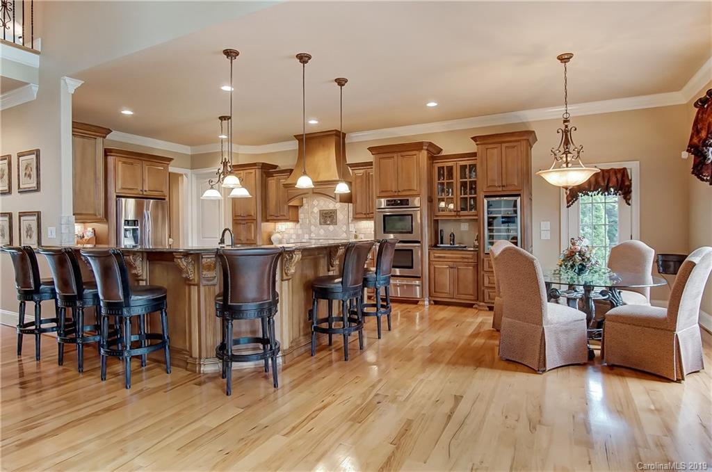 556 Medora Lane Fort Mill, SC 29708 - Photo 10 of 47 a room with lots of chairs and wooden floor