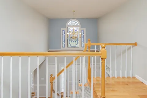 a view of front door with wooden floor
