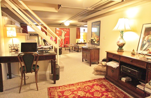 6350 North Indian Road Chicago, IL 60646 - Photo 16 of 23 a living room with lots of furniture and black appliances