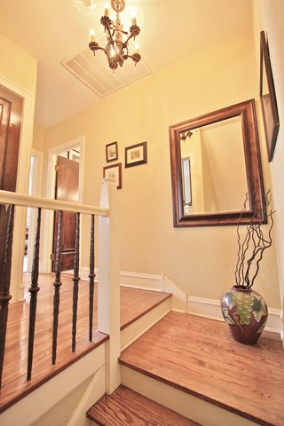 6350 North Indian Road Chicago, IL 60646 - Photo 9 of 23 a bedroom with a bed and wooden floor