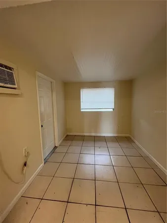 a view of an empty room and window