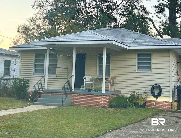 105 11th Avenue Mobile, AL 36611 - Photo 1 of 12 Bungalow-style home featuring a porch and a front lawn