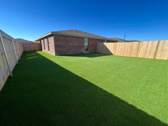 a view of a backyard with a small cabin