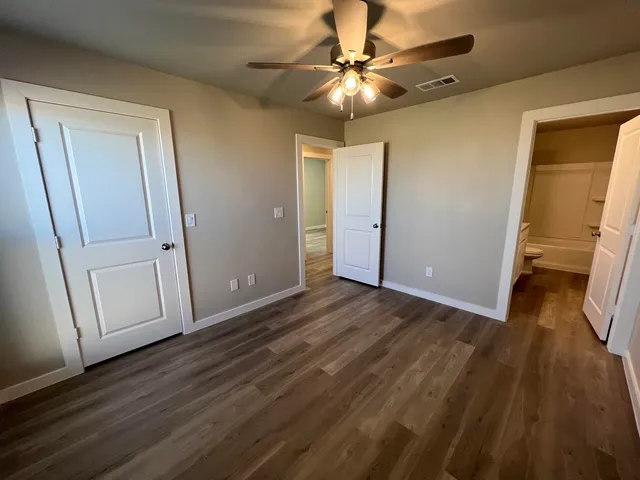 a view of a livingroom with wooden floor