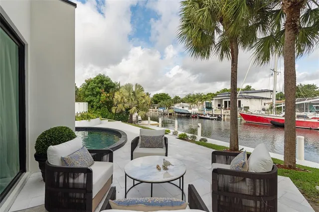 a living room with couches a coffee table and a flat screen tv