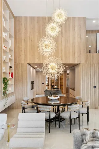 a lobby with furniture and a chandelier