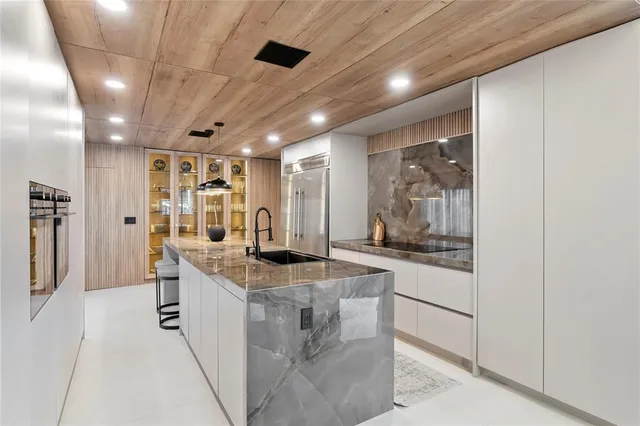 a bathroom with a tub sink and mirror