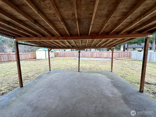 a view of a house with a yard and garage