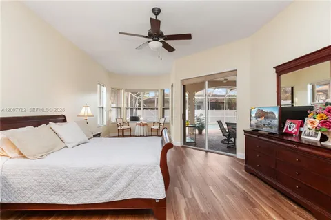 a work room with wooden floor and windows