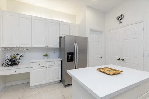 a kitchen with stainless steel appliances a stove a sink and a refrigerator