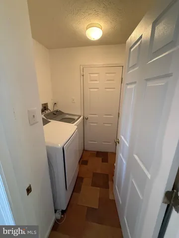 a view of entryway wih livingroom and stairs