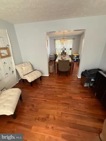 a living room with furniture rug and window