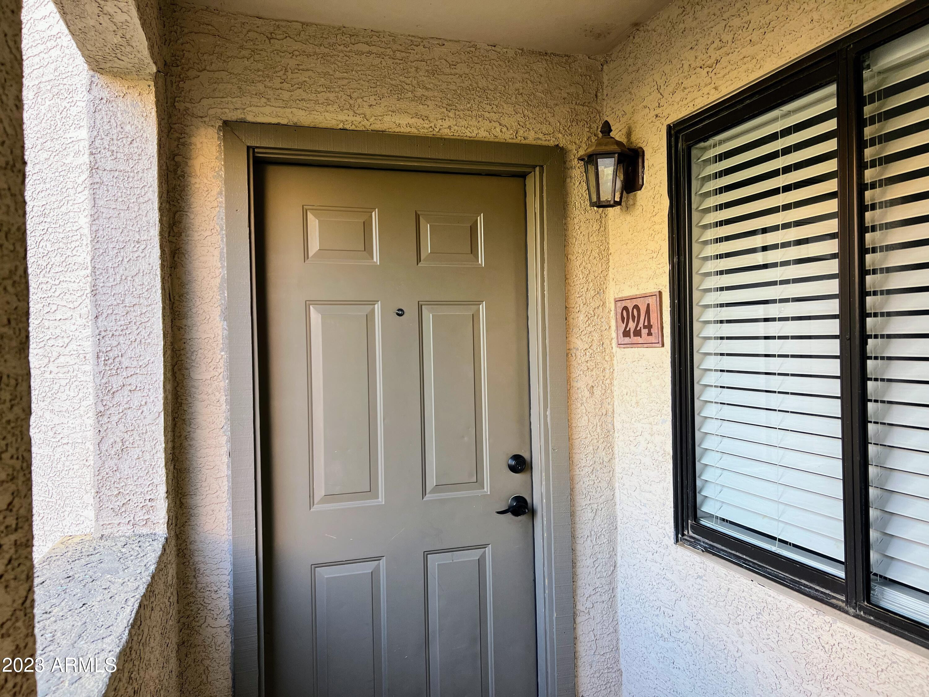 1287 North Alma School Road, Unit 224 Chandler, AZ 85224 - Photo 1 of 8 a view of front door of house