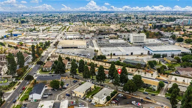 an aerial view of residential houses with outdoor space and street view