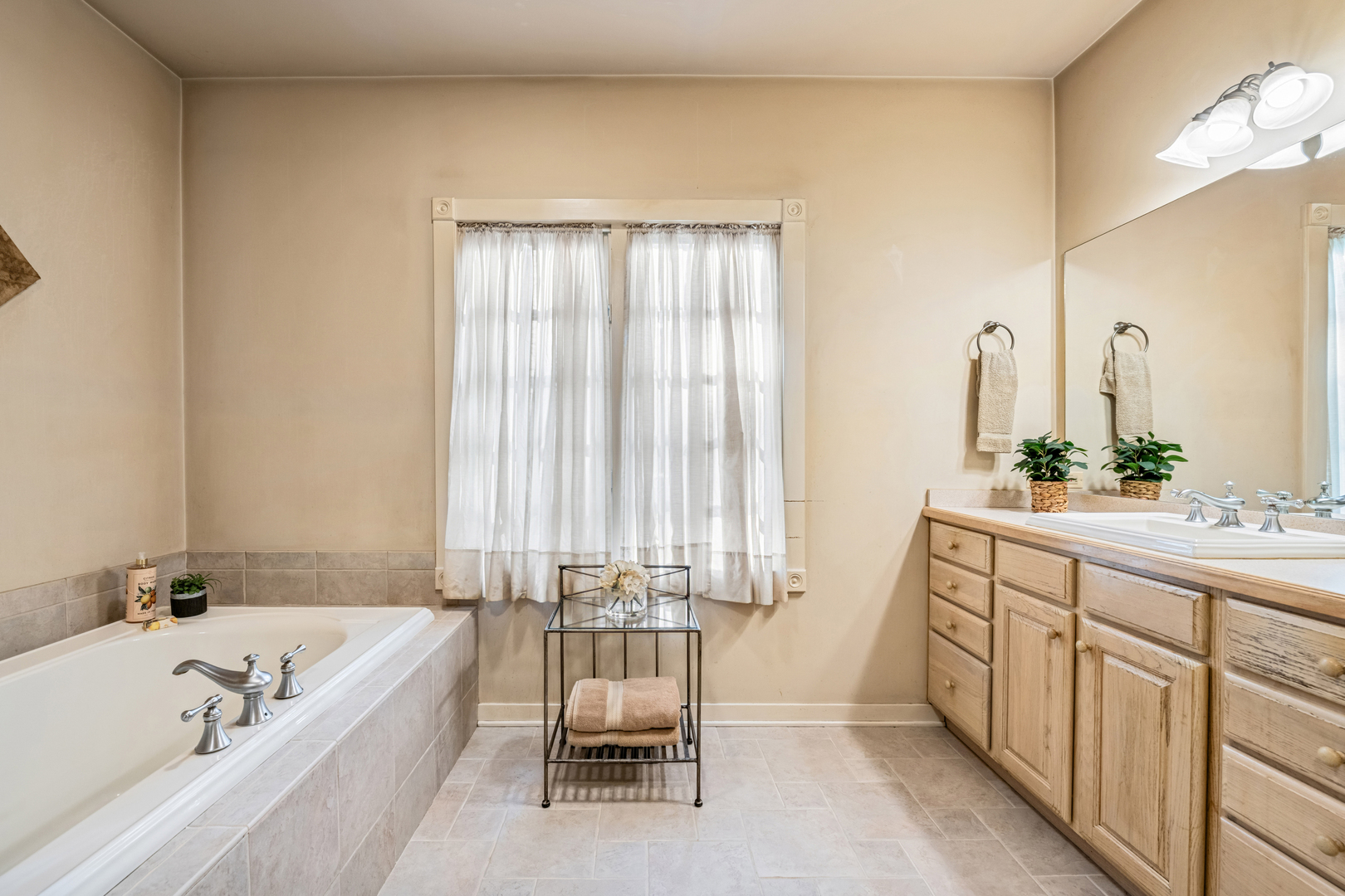 5116 Bonnie Brae Road Richmond, IL 60071 - Photo 11 of 27 a spacious bathroom with a double vanity sink and a bathtub