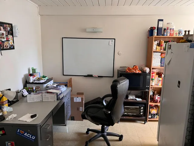 a view of a workspace with furniture and toys