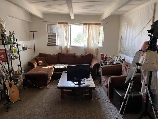 a living room with furniture and a window