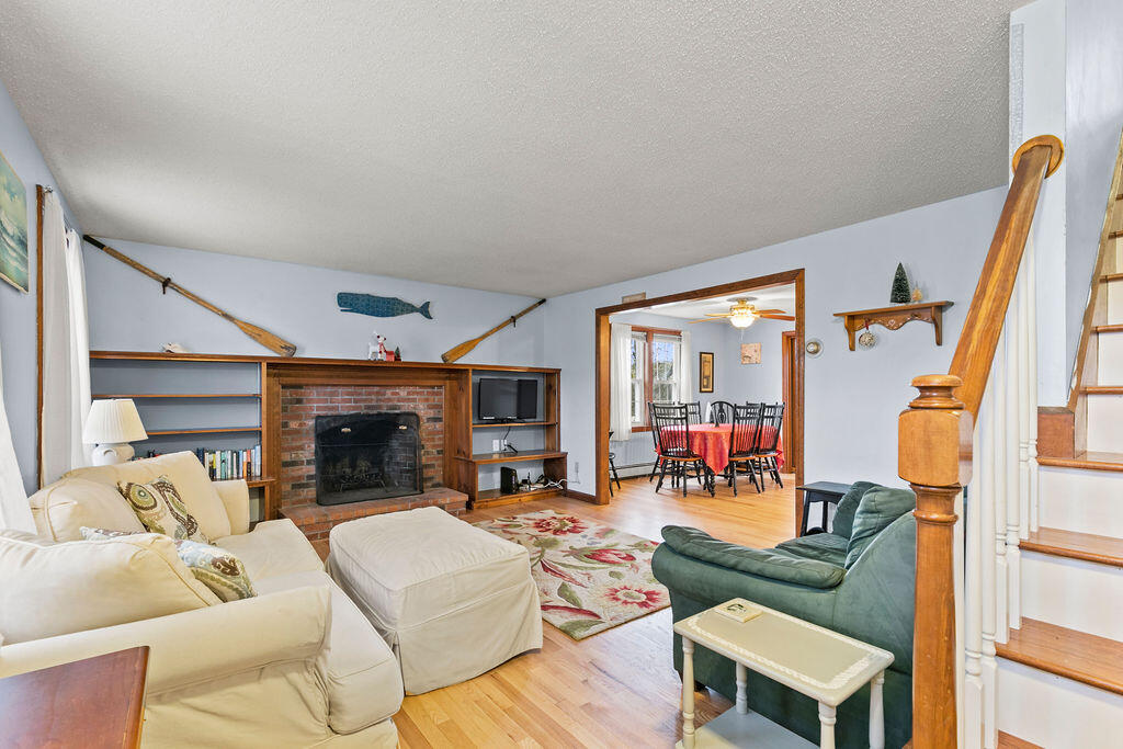 50 Circle Drive Hyannis, MA 02601 - Photo 13 of 32 a living room with furniture and a fireplace