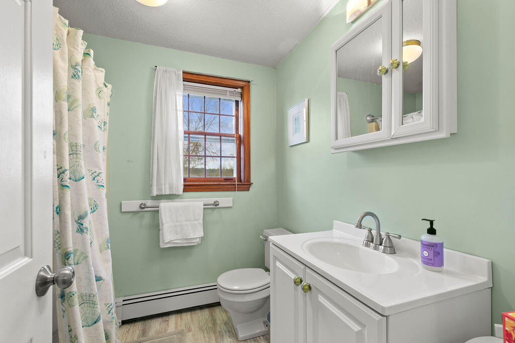 50 Circle Drive Hyannis, MA 02601 - Photo 15 of 32 a bathroom with a sink toilet and shower