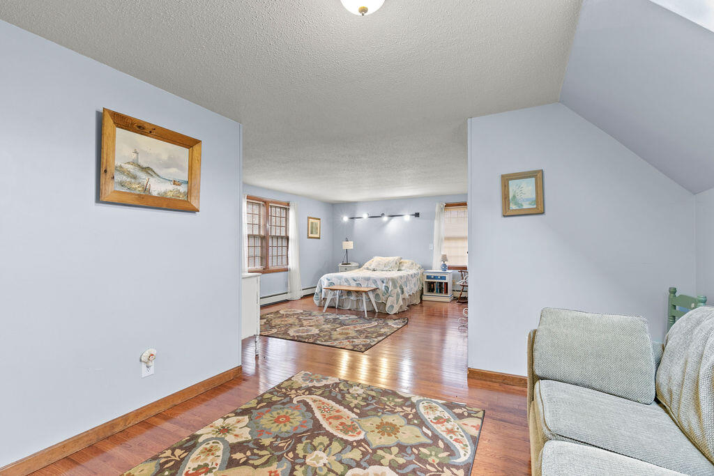 50 Circle Drive Hyannis, MA 02601 - Photo 17 of 32 a living room with furniture and a wooden floor