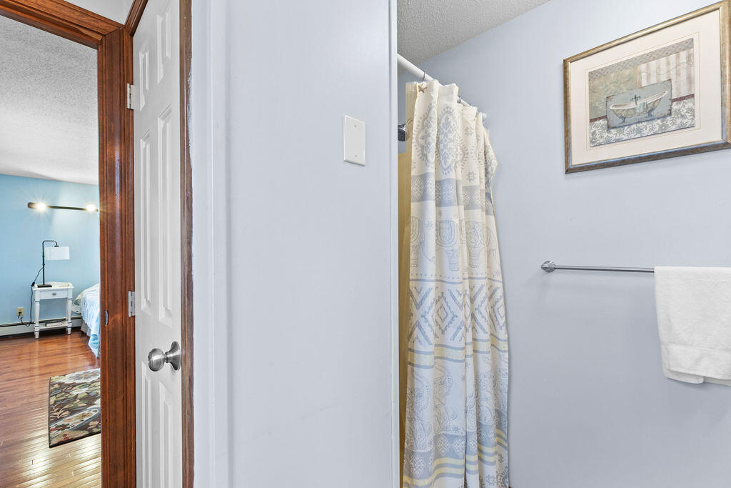 50 Circle Drive Hyannis, MA 02601 - Photo 21 of 32 a view of a hallway with paintings on the wall