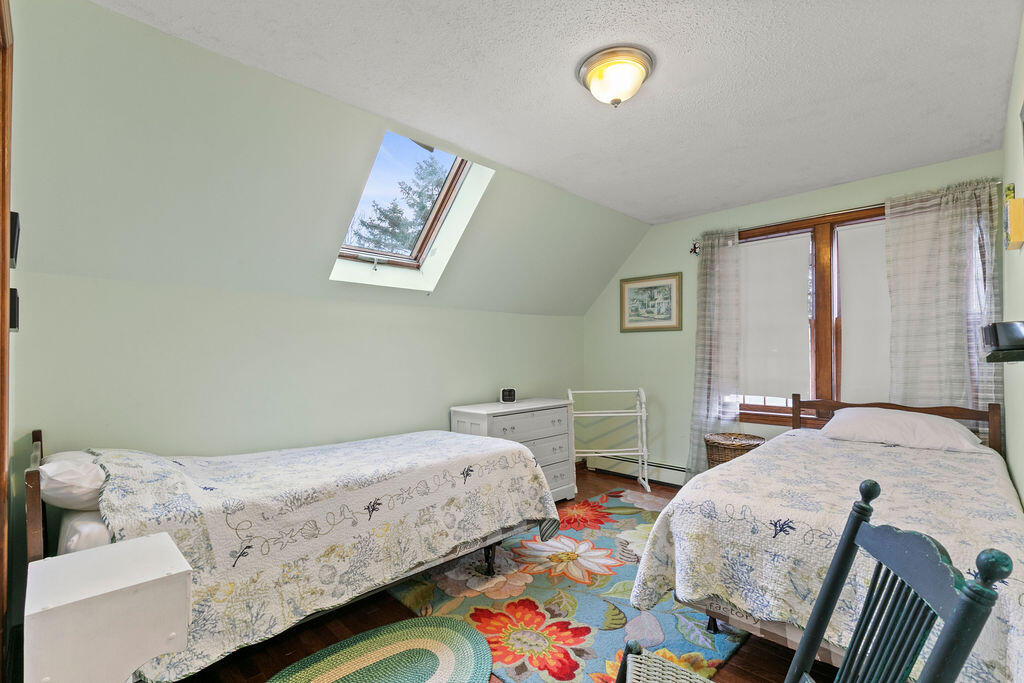 50 Circle Drive Hyannis, MA 02601 - Photo 23 of 32 a bedroom with two beds and a lamp