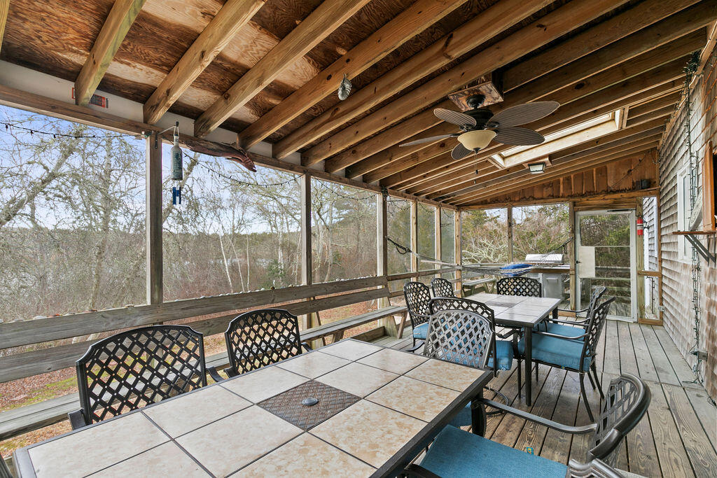 50 Circle Drive Hyannis, MA 02601 - Photo 26 of 32 a view of a porch with furniture and a yard