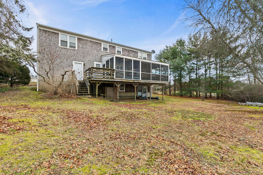 50 Circle Drive Hyannis, MA 02601 - Photo 5 of 32 a view of a house with backyard and trees
