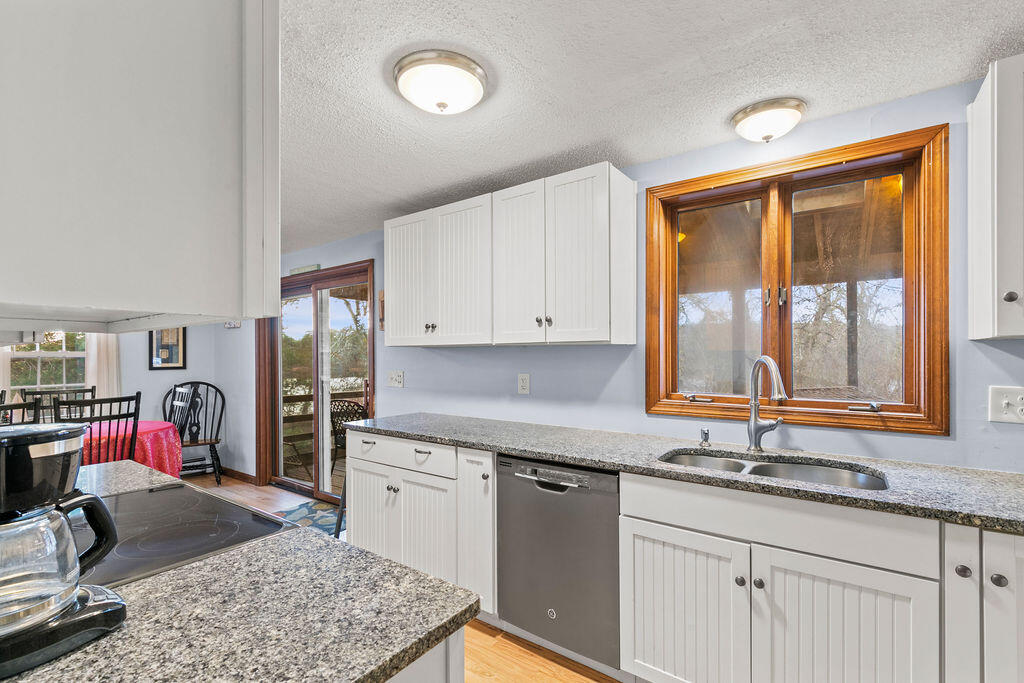 50 Circle Drive Hyannis, MA 02601 - Photo 9 of 32 a kitchen with sink and cabinets