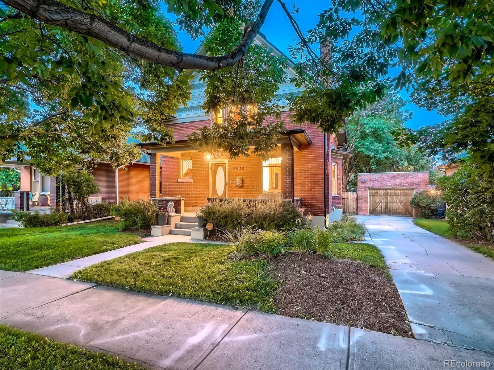 3548 Decatur Street Denver, CO 80211 - Photo 1 of 40 a front view of a house with a yard and tree s