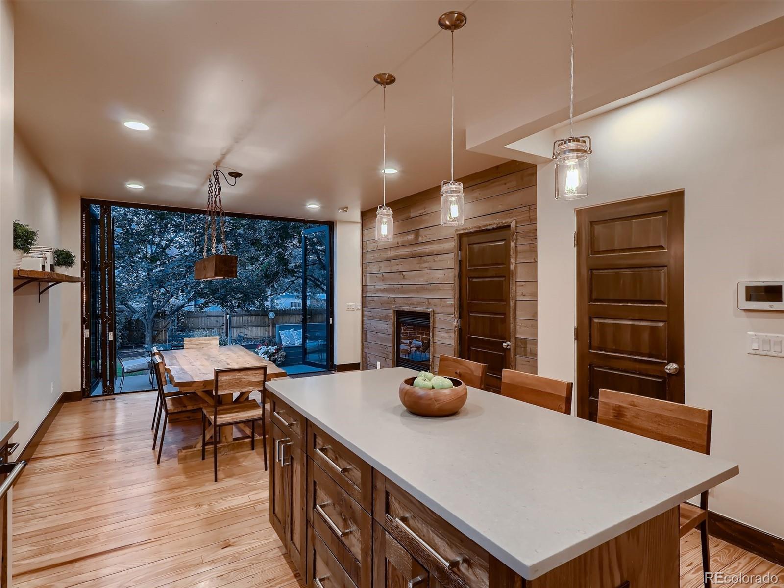 3548 Decatur Street Denver, CO 80211 - Photo 12 of 40 a view of a dining room with furniture window and wooden floor
