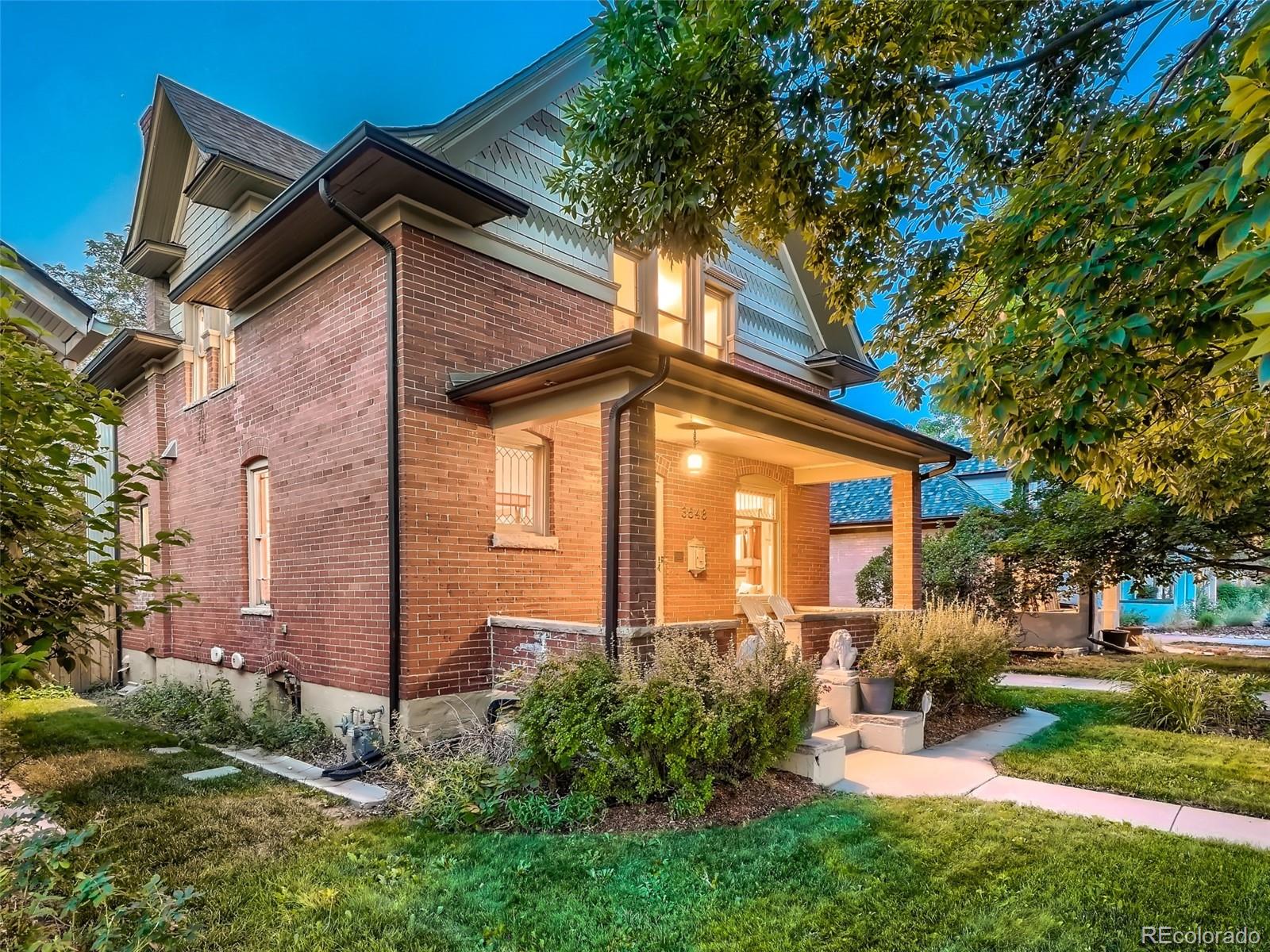 3548 Decatur Street Denver, CO 80211 - Photo 2 of 40 a front view of a house with garden