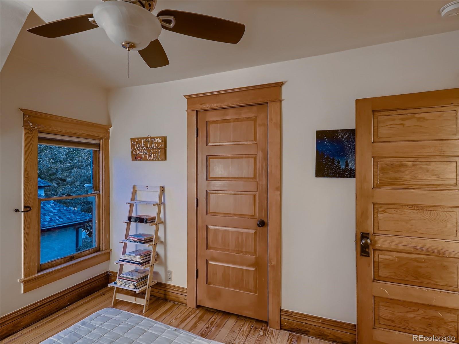 3548 Decatur Street Denver, CO 80211 - Photo 23 of 40 workspace with wooden floor closet and windows