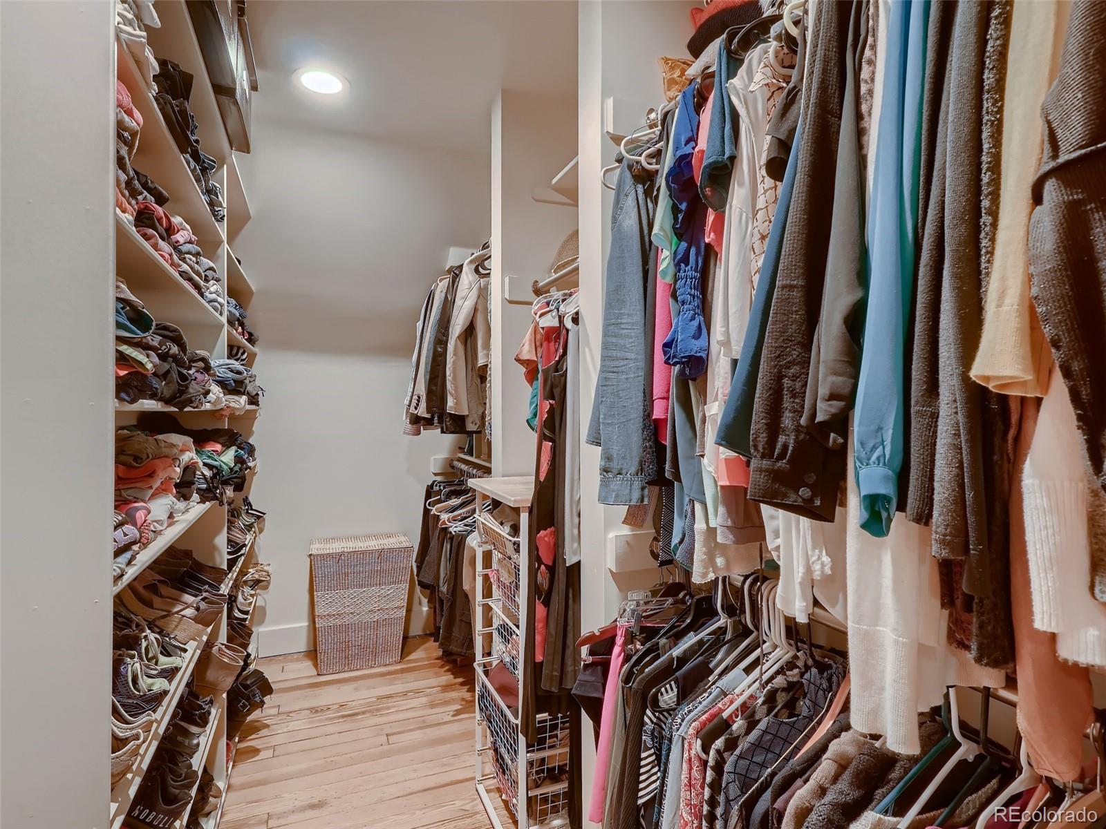 3548 Decatur Street Denver, CO 80211 - Photo 24 of 40 a view of walk in closet with clothes