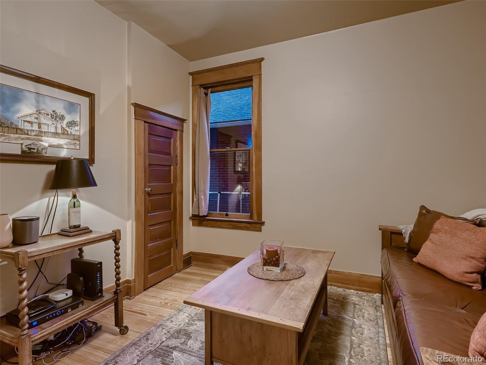 3548 Decatur Street Denver, CO 80211 - Photo 34 of 40 a living room with furniture and a flat screen tv