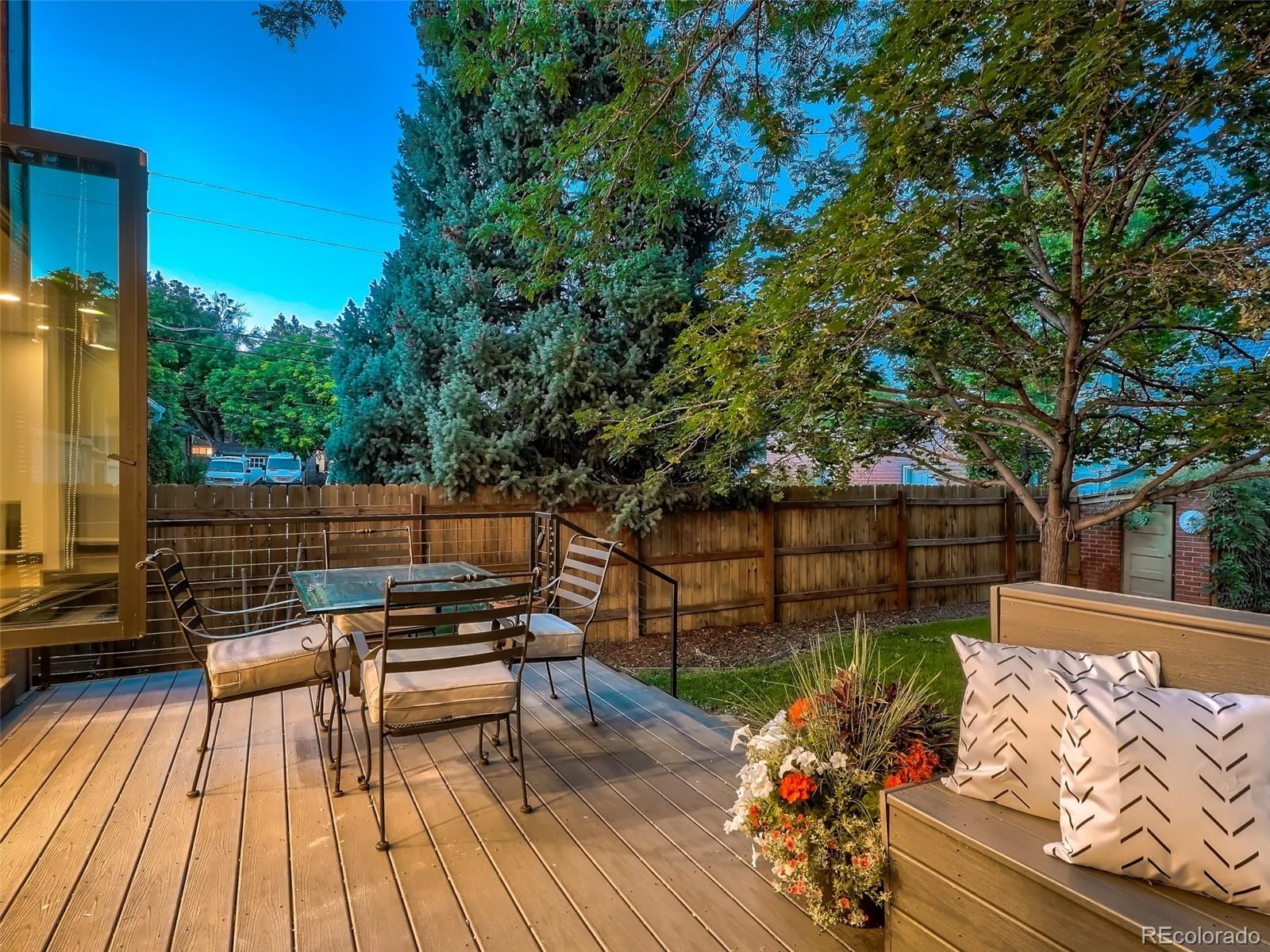 3548 Decatur Street Denver, CO 80211 - Photo 35 of 40 a view of a roof deck with wooden floor and fence