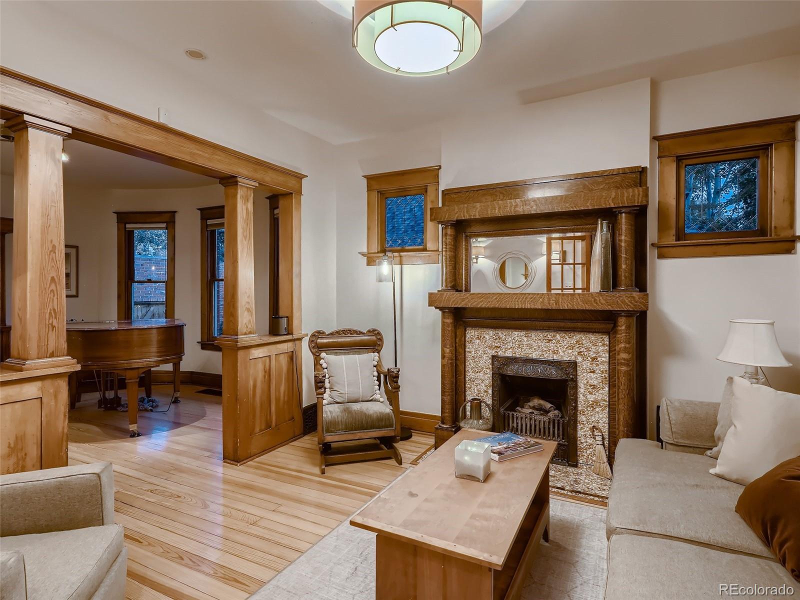 3548 Decatur Street Denver, CO 80211 - Photo 6 of 40 a living room with furniture and a fireplace
