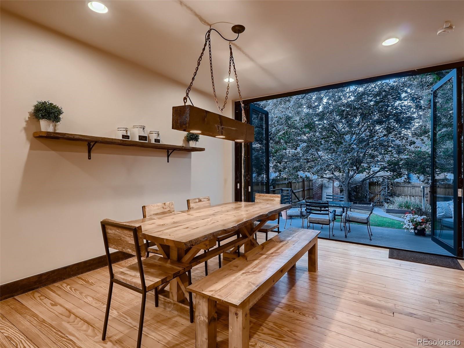 3548 Decatur Street Denver, CO 80211 - Photo 8 of 40 a view of a dining room with furniture window and wooden floor