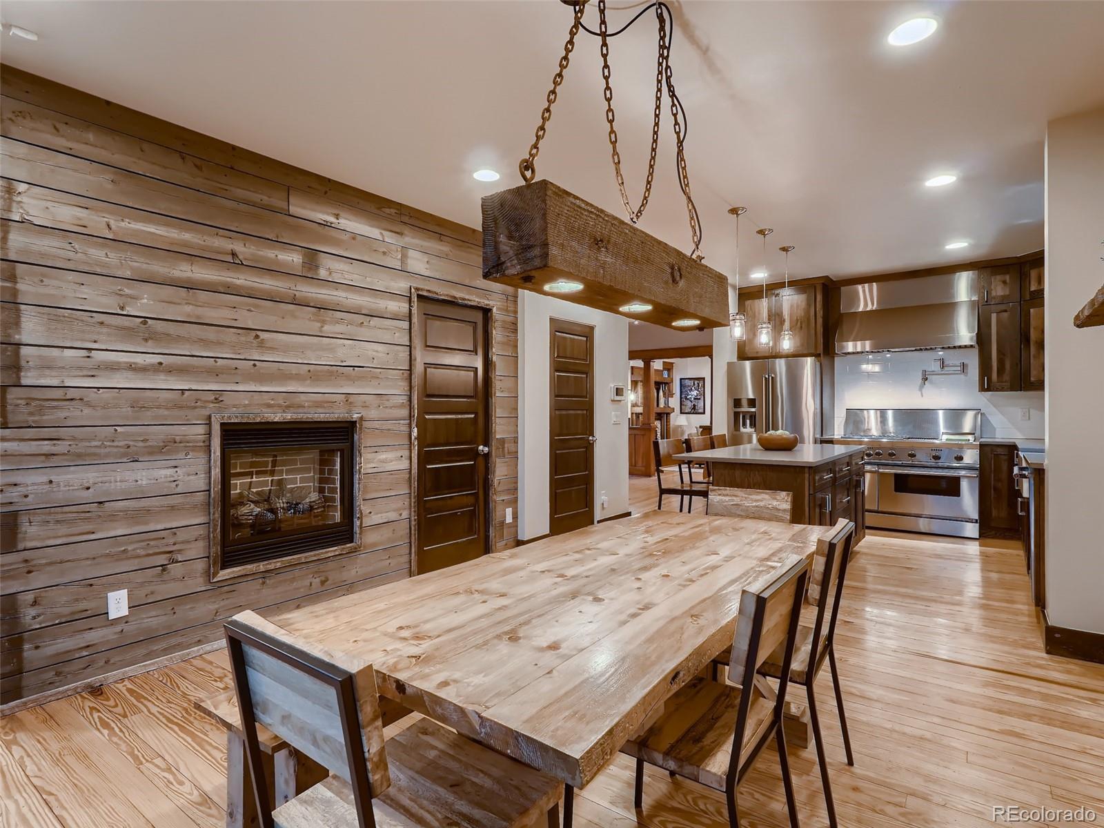 3548 Decatur Street Denver, CO 80211 - Photo 9 of 40 a dining room with a wooden table and chairs