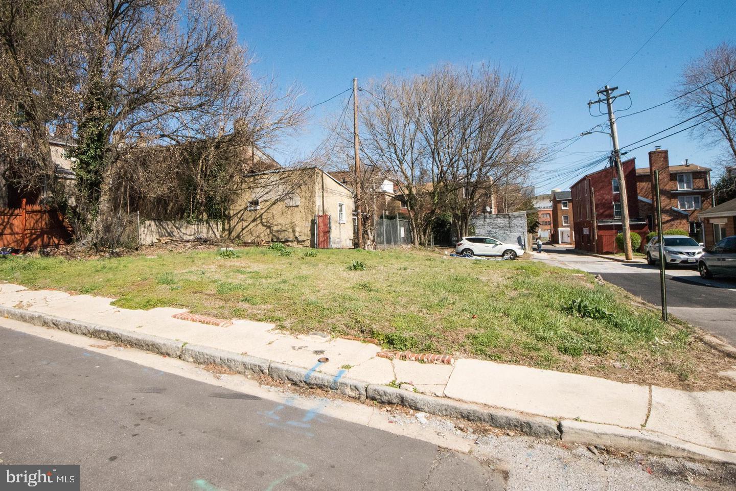 840 Lemmon Street Baltimore, MD 21201 - Photo 3 of 6 a view of a yard with cars on road