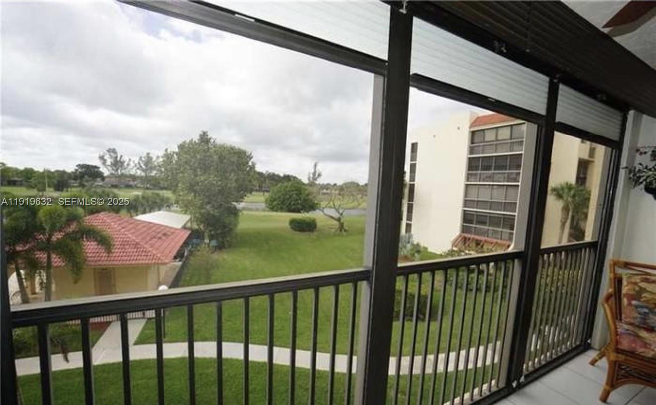 3521 Environ Boulevard, Unit B308 Lauderhill, FL 33319 - Photo 12 of 15 a view of a balcony with a green space